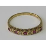 A 9ct gold ruby and diamond nine stone r