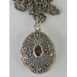 A 925 silver and marcasite locket, compl