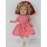 A Shirley Temple doll by Ideal, with sle