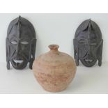 A pair of 20th century African pierced a