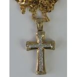 A 9ct gold and diamond encrusted cross p