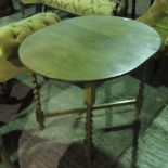 A stained oak table raised over barley t