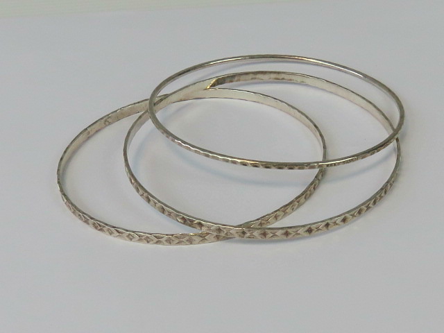 A pair of sterling silver bangles, toget