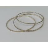 A pair of sterling silver bangles, toget