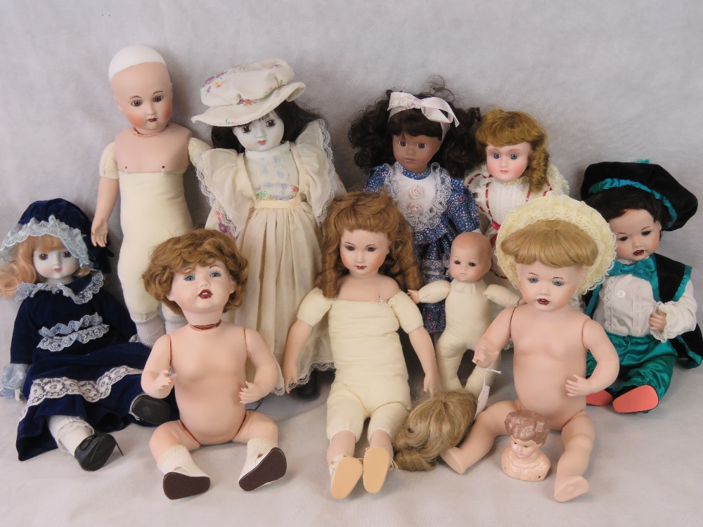 Various modern bisque headed dolls, some