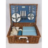 A vintage wicker Sirram picnic basket complete with original contents; Aladdin flask,