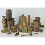 A collection of old brass fire hose fittings including a nozzle,