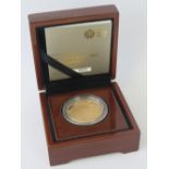 A 22ct gold proof 2013 'Christening of HRH Prince George' £5 coin, 39.