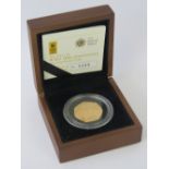 A 22ct gold proof 2011 'WWF 50th Anniversary' 50p coin, 15.