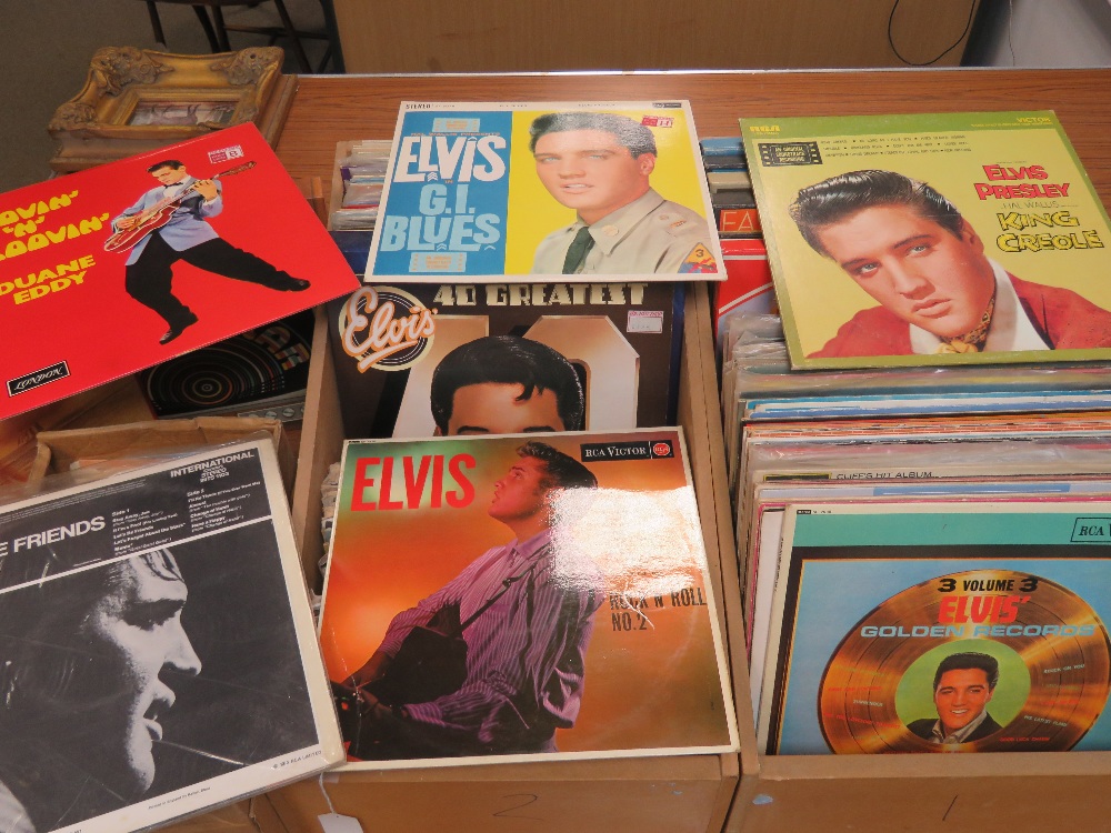 A quantity of LPs including Elvis Presley, together with a quantity 1970/80s 45rpm singles.