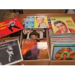 A quantity of LPs including Elvis Presley, together with a quantity 1970/80s 45rpm singles.