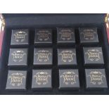 A 24ct gold proof set of twelve 2009 Half-Crown coins,