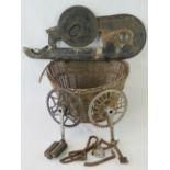 A quantity of vintage bicycle parts including chains, sprockets, chain guard, wicker basket, etc.