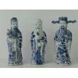 A modern Chinese blue and white figure of Shou Lao and two other similar figures of deities,