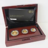 A 22ct gold three coin proof 2014 set comprising £50, £25 and £10 coins, total weight 28.