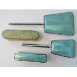 A 1960s three piece chrome dressing table set with faux enamelled backs and a clothes brush with
