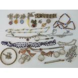 A quantity of assorted costume jewellery including white metal rings, copper and brass bangle,