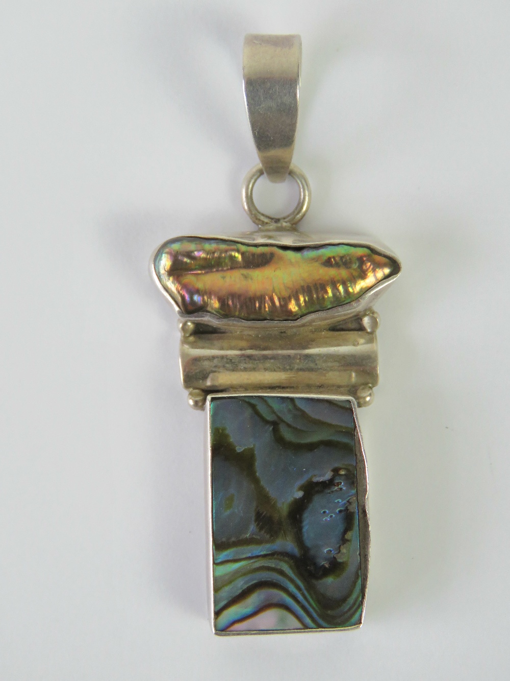 A silver pendant set with rectangular abalone shell panel and pearl, stamped 925, 5.3cm inc bale.