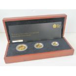 A 22ct gold three coin proof 2013 set comprising £50, £25 and £10 coins, total weight 28.