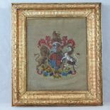 A 19thC wool needlework and bead panel of the royal coat of arms, 51cm x 43cm.