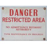 An army danger sign ' Restricted area no admittance without authority tank maintenance in progress',