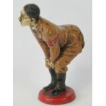 A novelty pin cushion in the form of Adolf Hitler, enamel on brass, standing 11.8cm high.