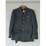 A vintage RAF uniform complete with brass buttons and VR badges,