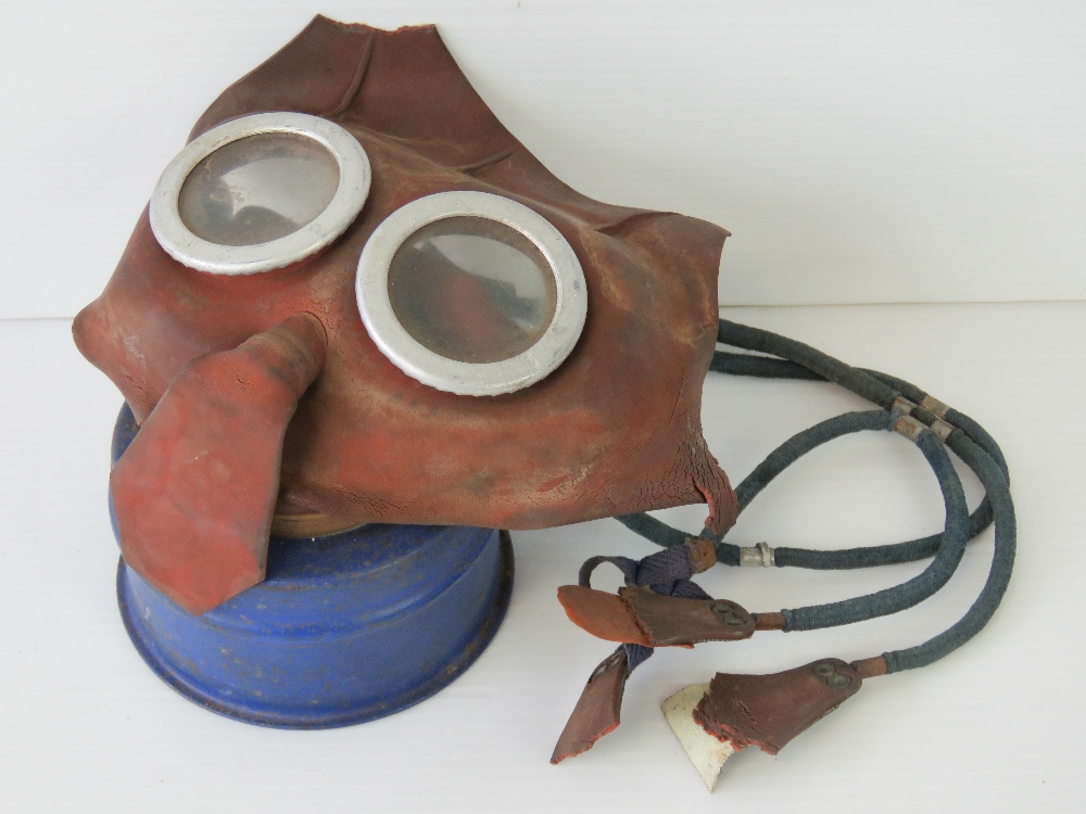 A rubberised child's gas mask made by L&BR Co Ltd, a/f.