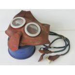 A rubberised child's gas mask made by L&BR Co Ltd, a/f.