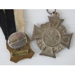 A WWI German veterans items; large size medal without ribbon, enamel badge with pin to back,