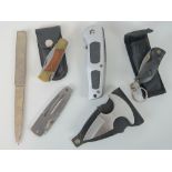 Three modern pocket knives with pouches,