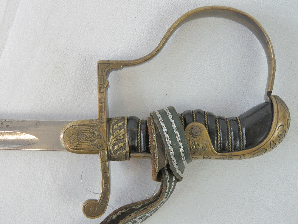 A WWII German sword with engraved oak leaf pattern throughout, - Image 3 of 4