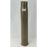 A WWII 3" cannon brass shell case with US tank marks, dated 1944, 58cm in length.