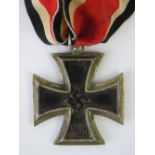 A WWII German Knights Cross medal with ribbon, some light corrosion to both sides.