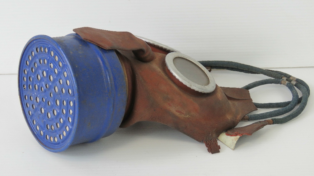 A rubberised child's gas mask made by L&BR Co Ltd, a/f. - Image 2 of 2