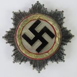 A WWII German 'Gold' Cross badge, pin marked '1'.