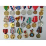 Thirteen Eastern Europen medals, a Belgian 1914-18 medal and Order of the Crown medal,