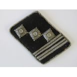 A WWII German Officers collar patch with silver thread embroidery.