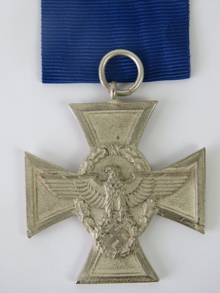 A WWII German Police medal with ribbon and presentation case.