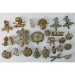 A quantity of military badges including; 17th Lancers 'Or Glory' badge, RFC, Royal Kent West,