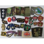 Thirty-four mixed military and police cloth badges of various ages including; SAS ACF,