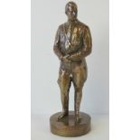 A bronze patina brass figurine of Adolf HItler, standing 28cm high.