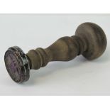 A WWII German ink stamp with turned wooden handle, standing 12.5cm high.