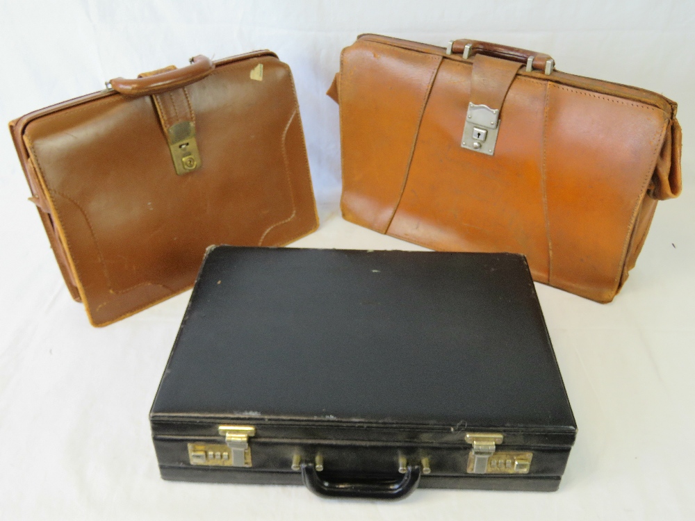 Two vintage brown leather brief cases an