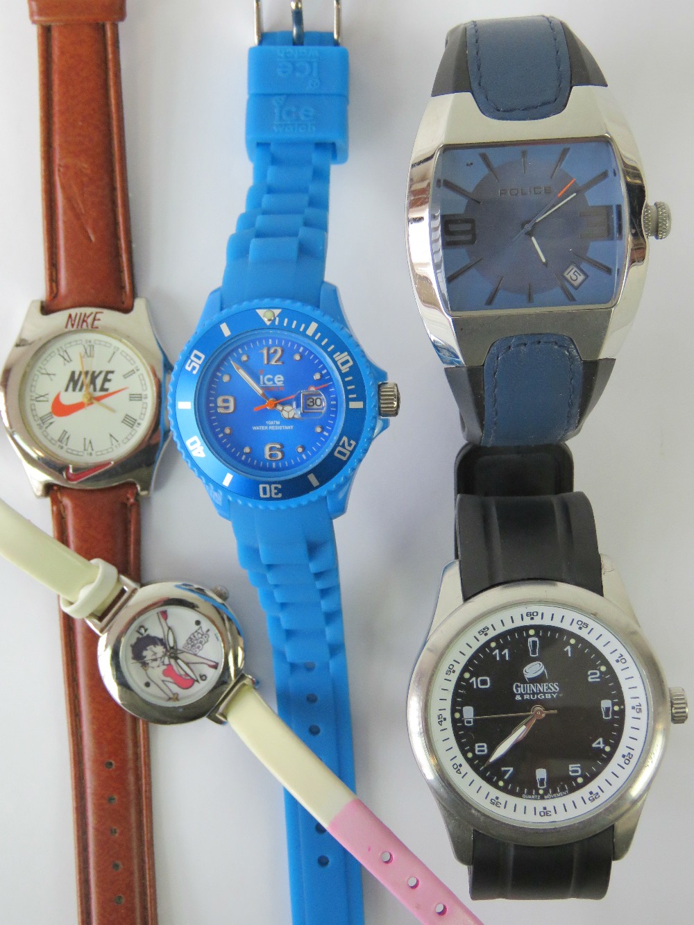 Four mens wristwatches; marked for Guinn