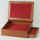 A modern sapele writing slope with red l