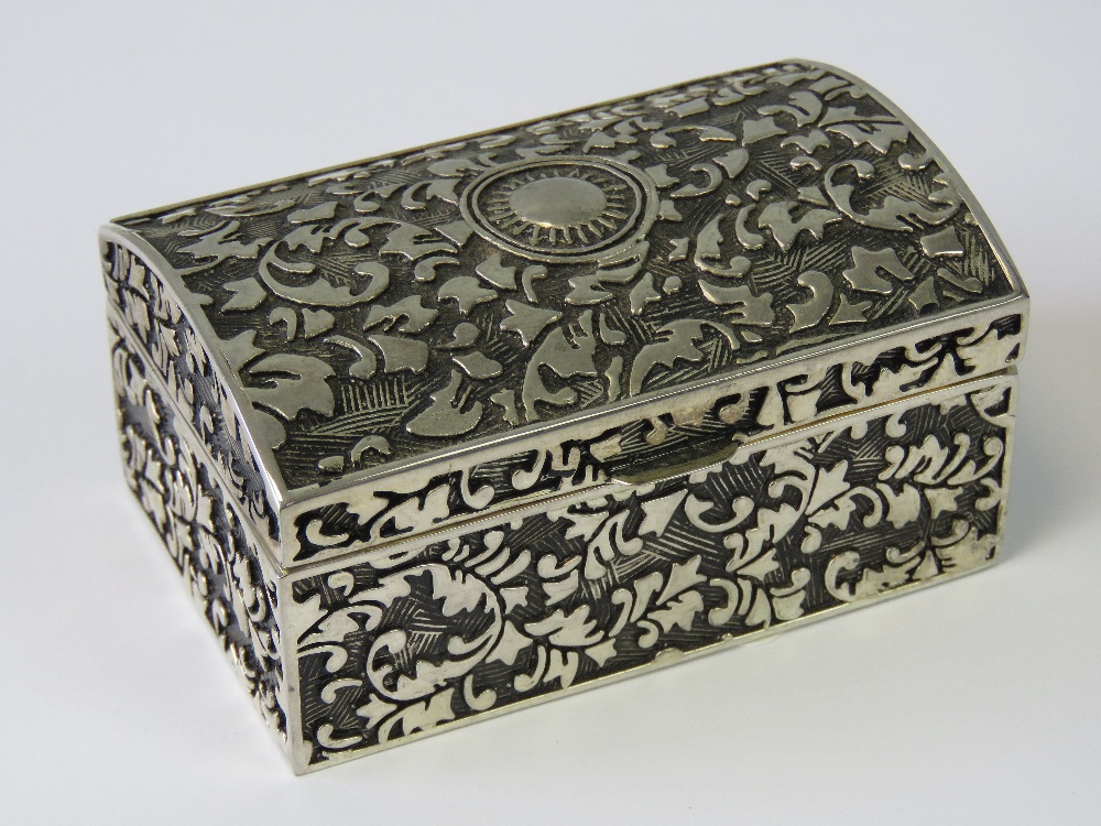 A white metal jewellery box, lid lifting