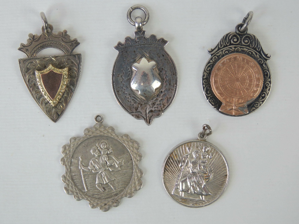 Three HM silver fobs, one with rose metal dartboard design upon and engraved for 1957,