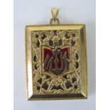 A large 18ct gold locket in the form of a book having blue enamel to front and red enamel to back,