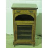 A fine Victorian inlaid walnut music cabinet having single drawer over arched compartment,